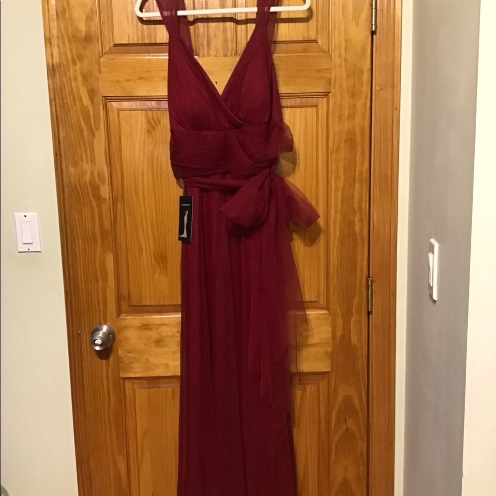 Ever  pretty BRAND NEW Maroon party dress. Tulle belted, never been worned